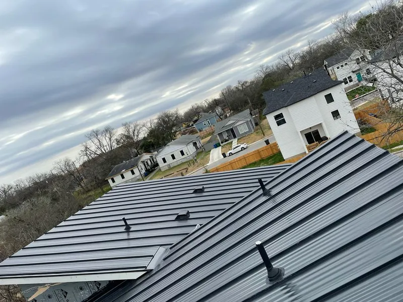 Standing seam metal roof panels with vents for Skylight Repair in Garrett